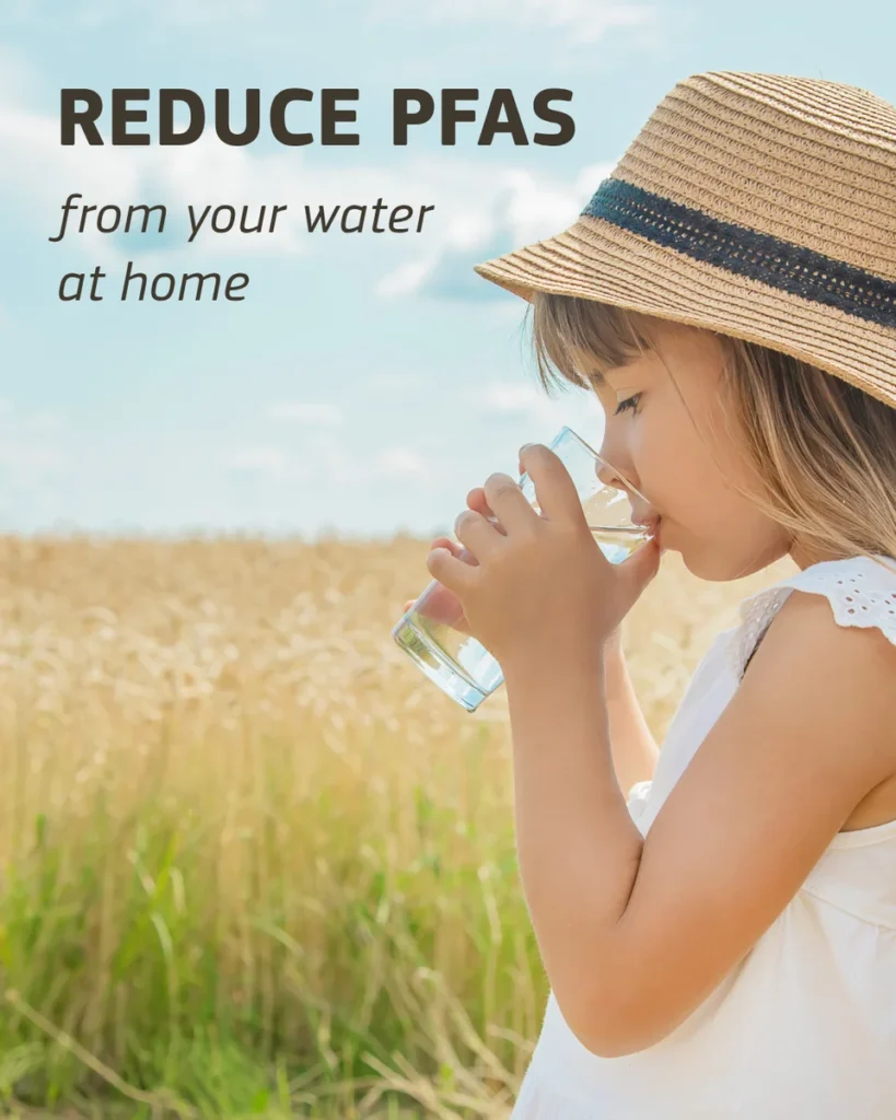 Girl drinking a glass of water in a wheat field – reduce PFAS from your water at home